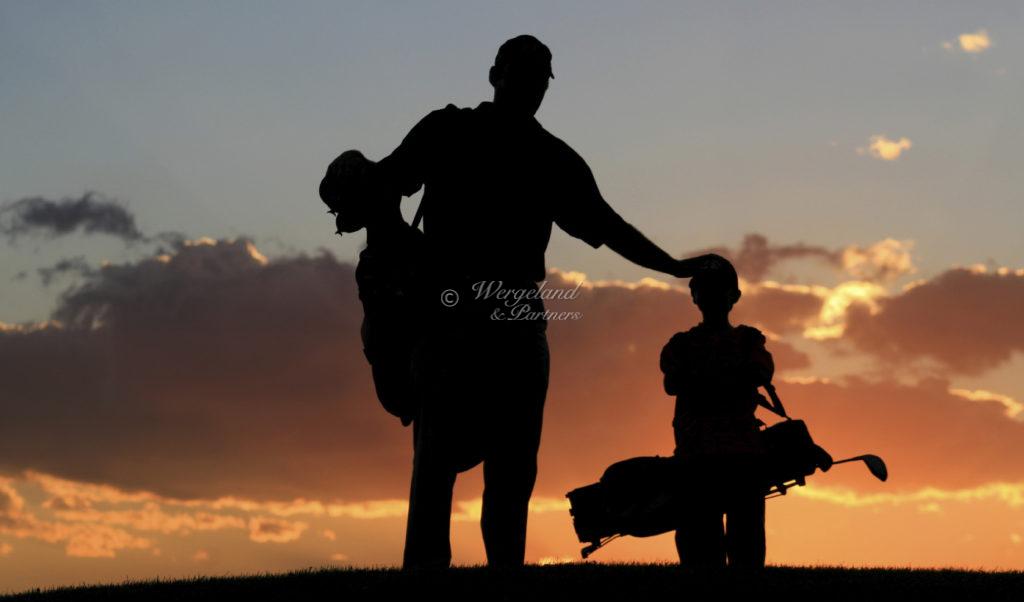  Father And Son Golfers In The Sunset